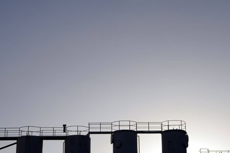 Four Tops Of Industrial Silos / Tanks As Silhouetteの写真素材