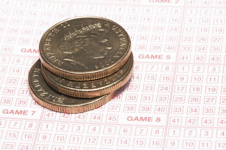 Close Up Of Lottery Ticket With Golden Coins