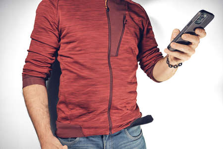 Man holding mobile phone in the handの写真素材