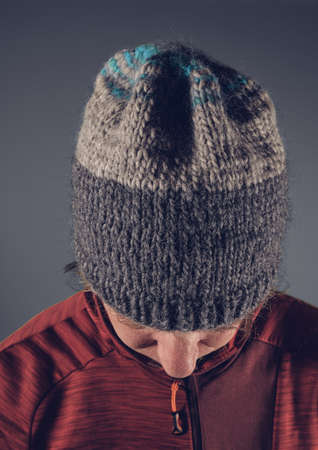 Man with wool cap on head