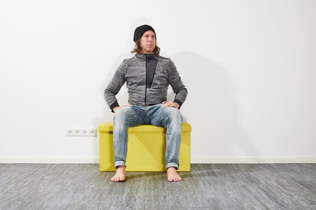 Man sitting on a green boxの写真素材