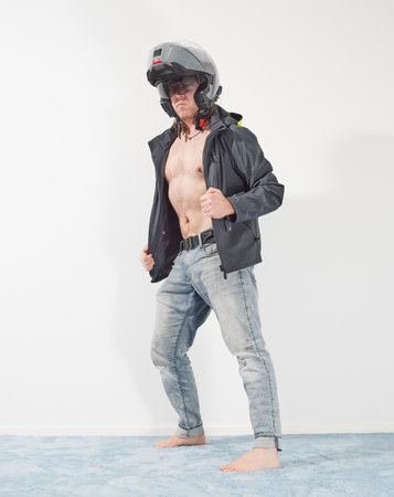 Man waiting for motorcycle season at homeの写真素材
