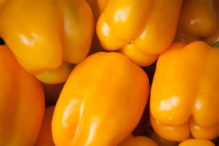 Yellow peppers on a marketの写真素材