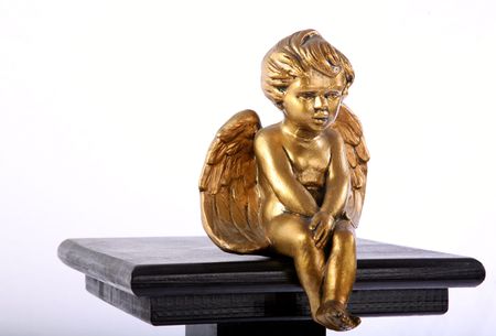 Golden angel on a pedestalの写真素材
