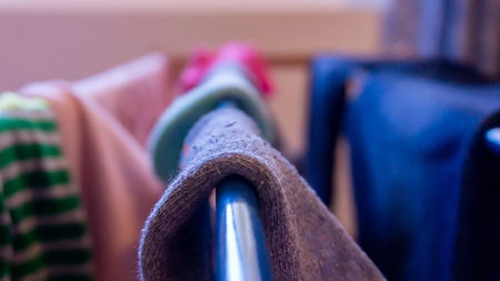 Close up of sock drying on a rack, daytime. Depicting laundry day, cleaning, house chores and...