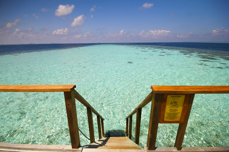 View of vilamendhoo island at the water bungalows side in the Indian Ocean Maldivesの写真素材