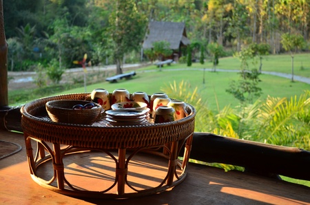 A tray used for serving food called Khantoke, made of bamboo strips interwoven with rattan and commonly used in the North and Northeast of Thailand, Laosの写真素材