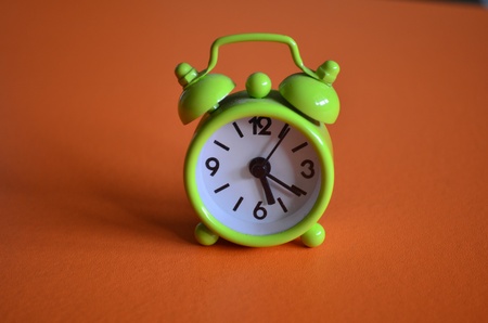 A green small alarm clockの写真素材