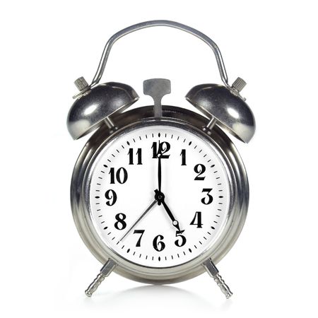Little old silver clock on a white background, indicates the five o'clock