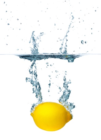 Fresh lemon falling into water  Isolated on white backgroundの写真素材