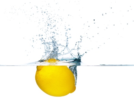 Fresh lemon falling into water  Isolated on white backgroundの写真素材