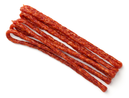 Thin smoked sausage isolated on white background. Kabanos sausage. Top viewの写真素材