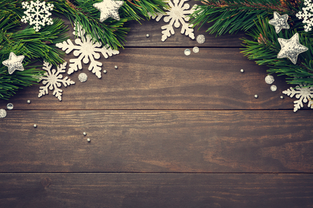 Christmas composition with snowflakes and stars on wooden background. Copy space. Top viewの写真素材