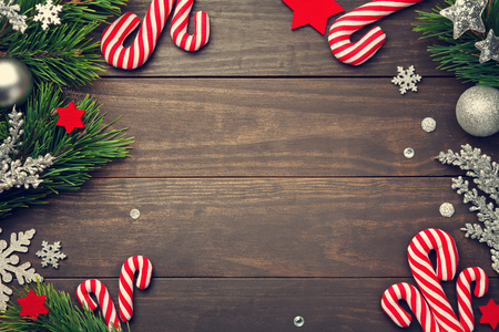 Christmas background with decorations on wooden table. Copy space. Top viewの写真素材