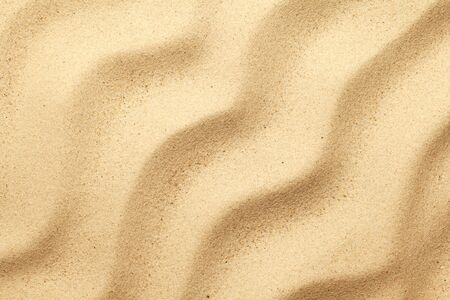 Sand background with waves. Flat lay. Top viewの写真素材