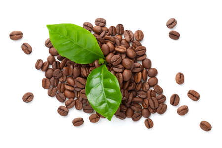 Pile of coffee beans with green leaves isolated on white background. Roasted arabica. Bio organic eco food. Top viewの写真素材