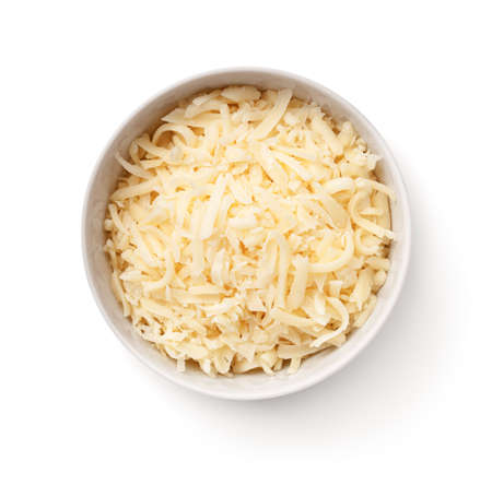 Grated gouda cheese in white bowl isolated on white background. Top viewの写真素材