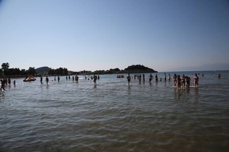 CORFU, GREECE - JULY, 23, 2016: Young people at Sidari beachのeditorial素材