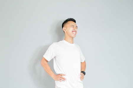 a young Asian is doing a sports warm-upの写真素材