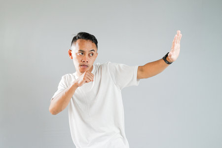 a young Asian is ready to fightの写真素材