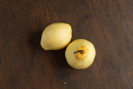 fresh pears on a beautiful wooden baseの写真素材