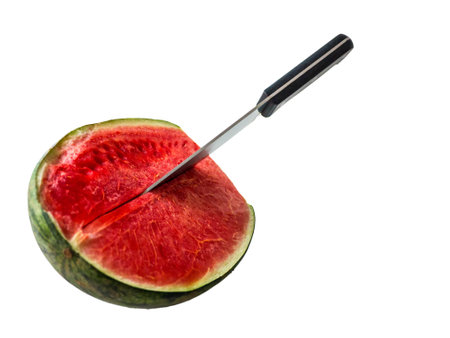 cut watermelon by knife on the white backgroundの写真素材