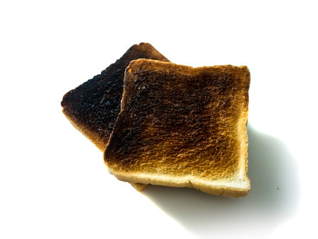 Burnt toast on white backgroundの写真素材