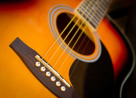 Fragment of red acoustic guitarの写真素材