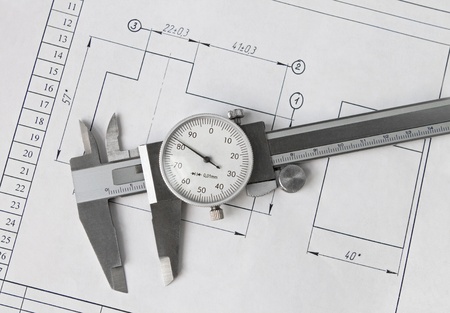 Caliper resting on drawingの写真素材