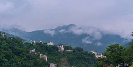 The high mountains on which the clouds are passing through, and this landscape looks very amazing to...