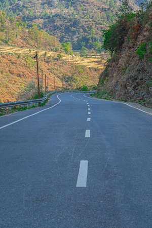 Windy paths with long hills, mountains on one side, moat on the other