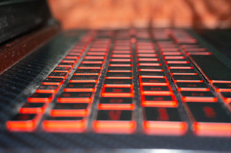 An attempt has been made to show the laptop keyboard from the side whose red light is burningの写真素材