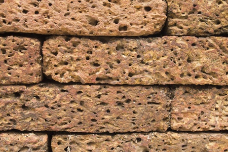 Stack of bricks building a wallの写真素材