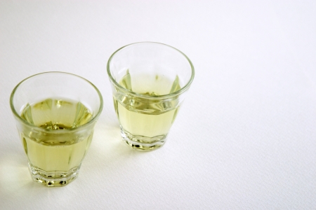 Two glasses of green tea was poured