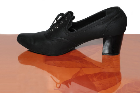 Women's fashion shoes isolated on a white and orange backgroundの写真素材
