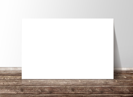 Blank white rectangle paper template banner on the wooden floor against the wallの写真素材