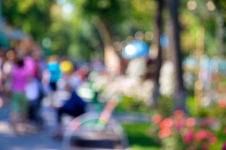 Blurred unfocused city view at day time. Unfocused people in the theme parkの写真素材