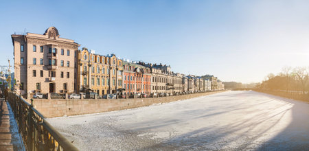 Panoramic view of Fontanka river embankment in sunny winter day. Saint Petersburg, Russiaの写真素材