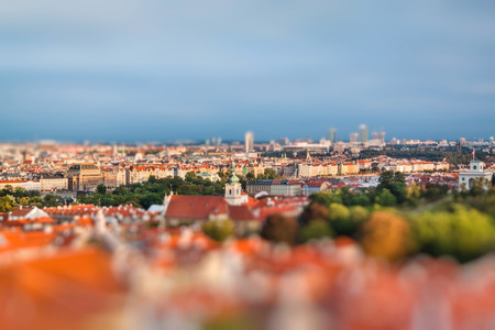 Aerial view of Prague, Czech Republic on a sunny evening. Miniature tilt shift lens effect.