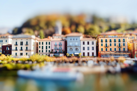 Colorful houses in Bellagio on a sunny autumn day, lake Como, Italy. Miniature tilt shift lens effect.の写真素材