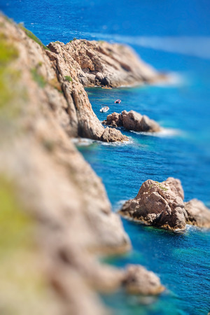 Closeup view of rocks in Costa Brava, Catalonia. Miniature tilt shift lens effect.の写真素材