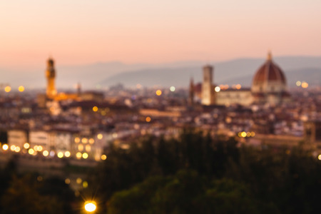 Blurred unfocused panoramic view to the river Arno, with Ponte Vecchio, Palazzo Vecchio and Cathedral of Santa Maria del Fiore (Duomo) at dusk time. Florence, Italyの写真素材