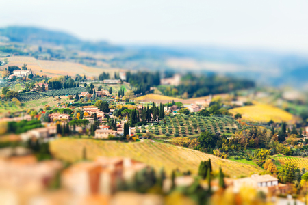 Panoramic view from San Gimignano in autumn, Tuscany, Italy. Miniature tilt shift lens effect.の写真素材