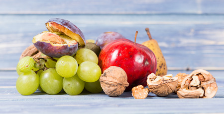 Wide picture with natural organic autumn fruits as fall harvest conceptの写真素材