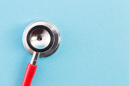 Stethoscope head on blue medical background with copy space and text areaの写真素材