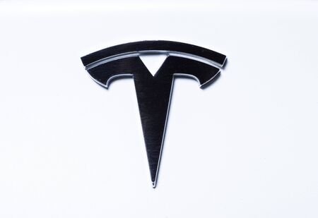 Tesla car logo on the back side as Elon Musk new electric technology conceptのeditorial素材