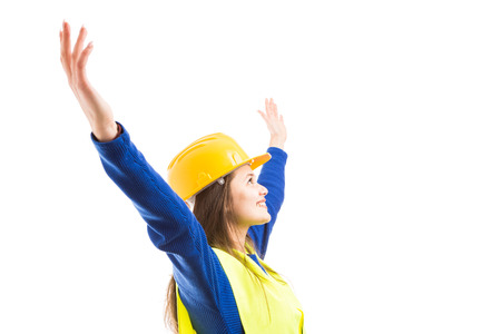 Young beautiful woman engineer or architect with arms stretched wide open as visionary successful...