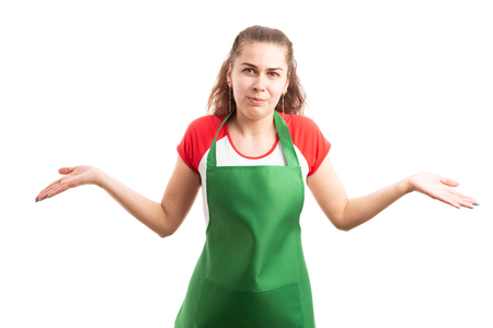 Young female supermarket or hypermarket worker making no idea gesture as confused not know concept isolated on white backgroundの写真素材