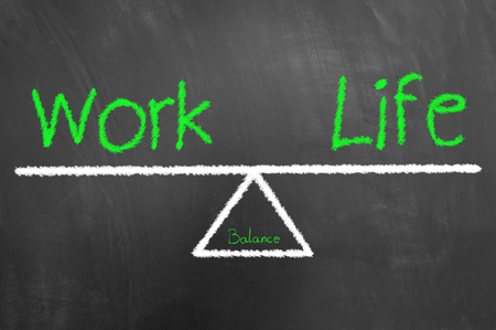 Work life balance green text and drawing on blackboard or chalkboard as healthy harmony lifestyle choice conceptの写真素材