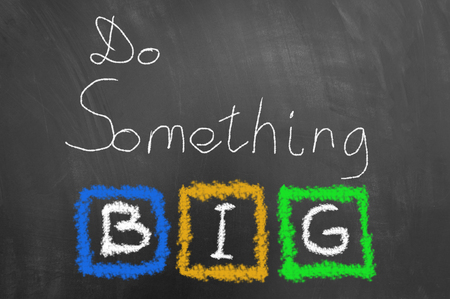 Do something big chalk text on blackboard or chalkboard as motivational inspiring optimistic vision message conceptの写真素材